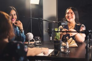 people recording podcast in a studio